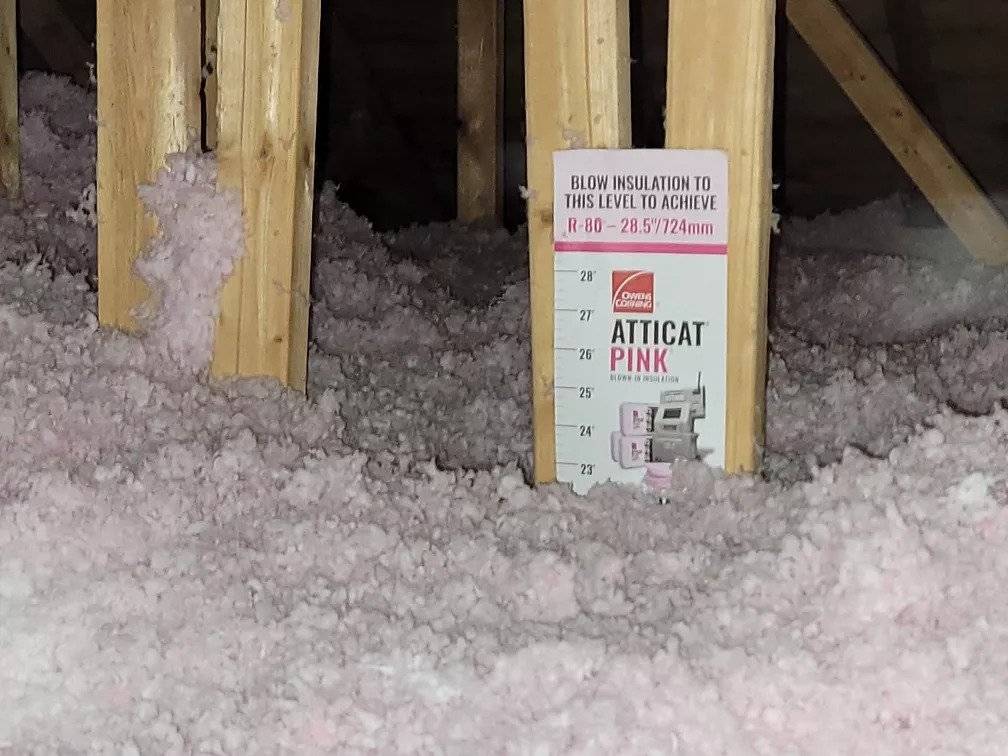 Attic insulation blown into a house