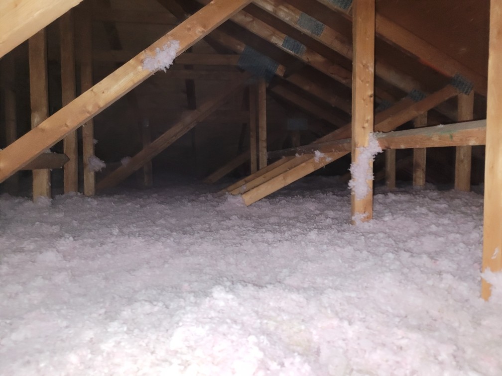 Fiberglass insulation in an attic